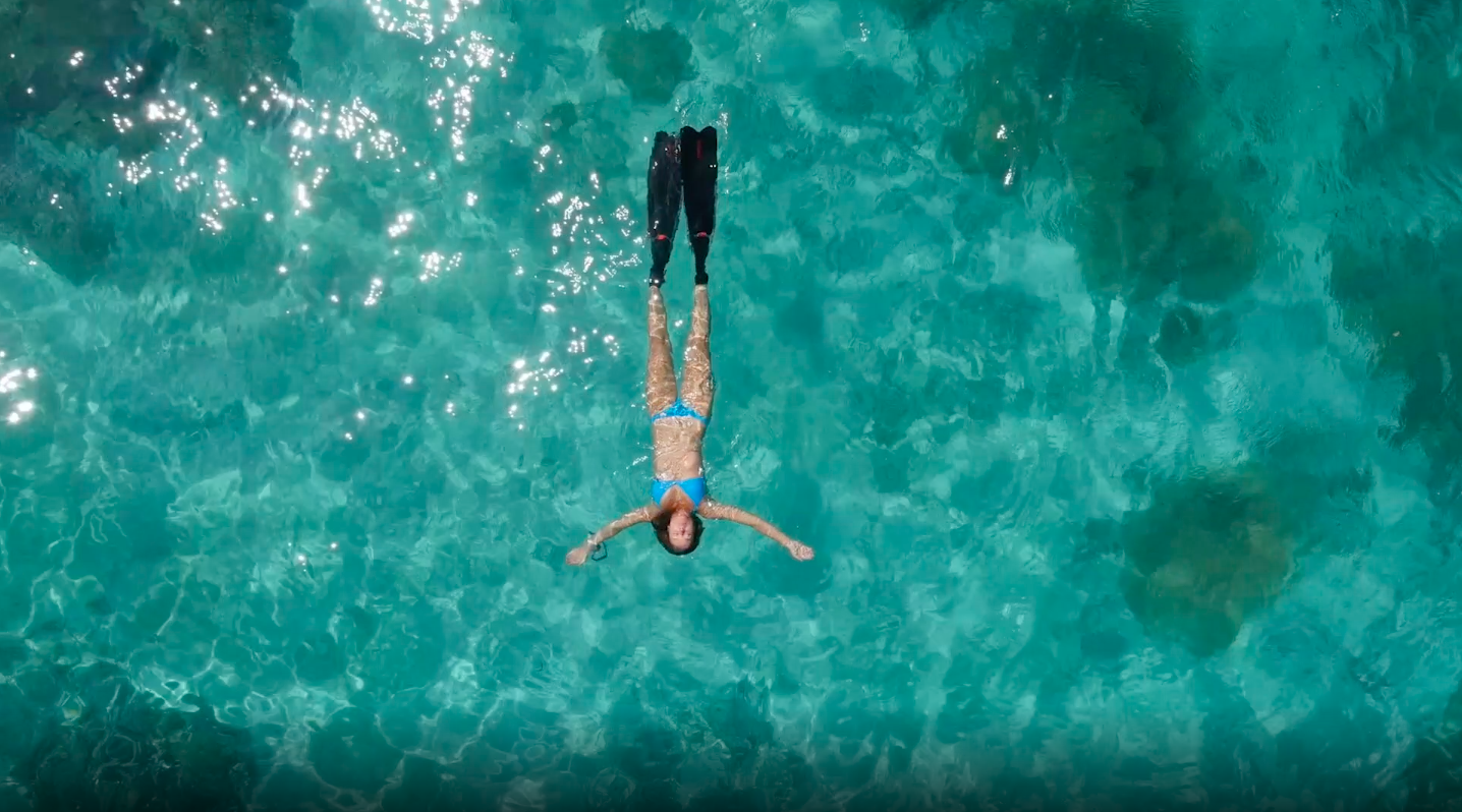 Woman swimming in ocean