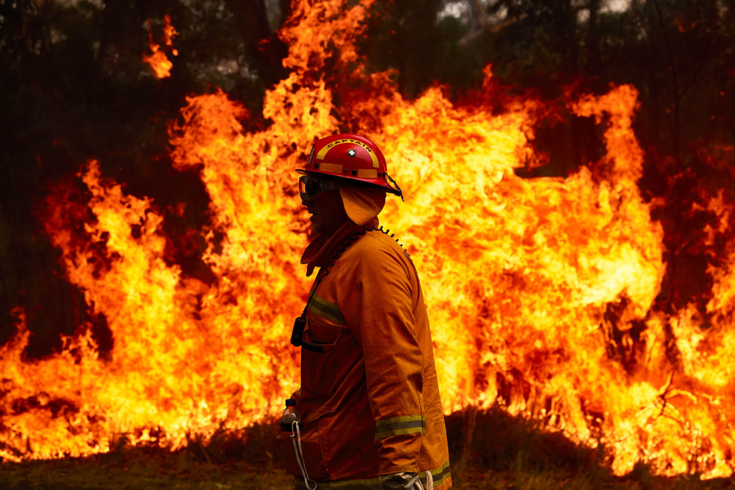 Fireman in front of fire