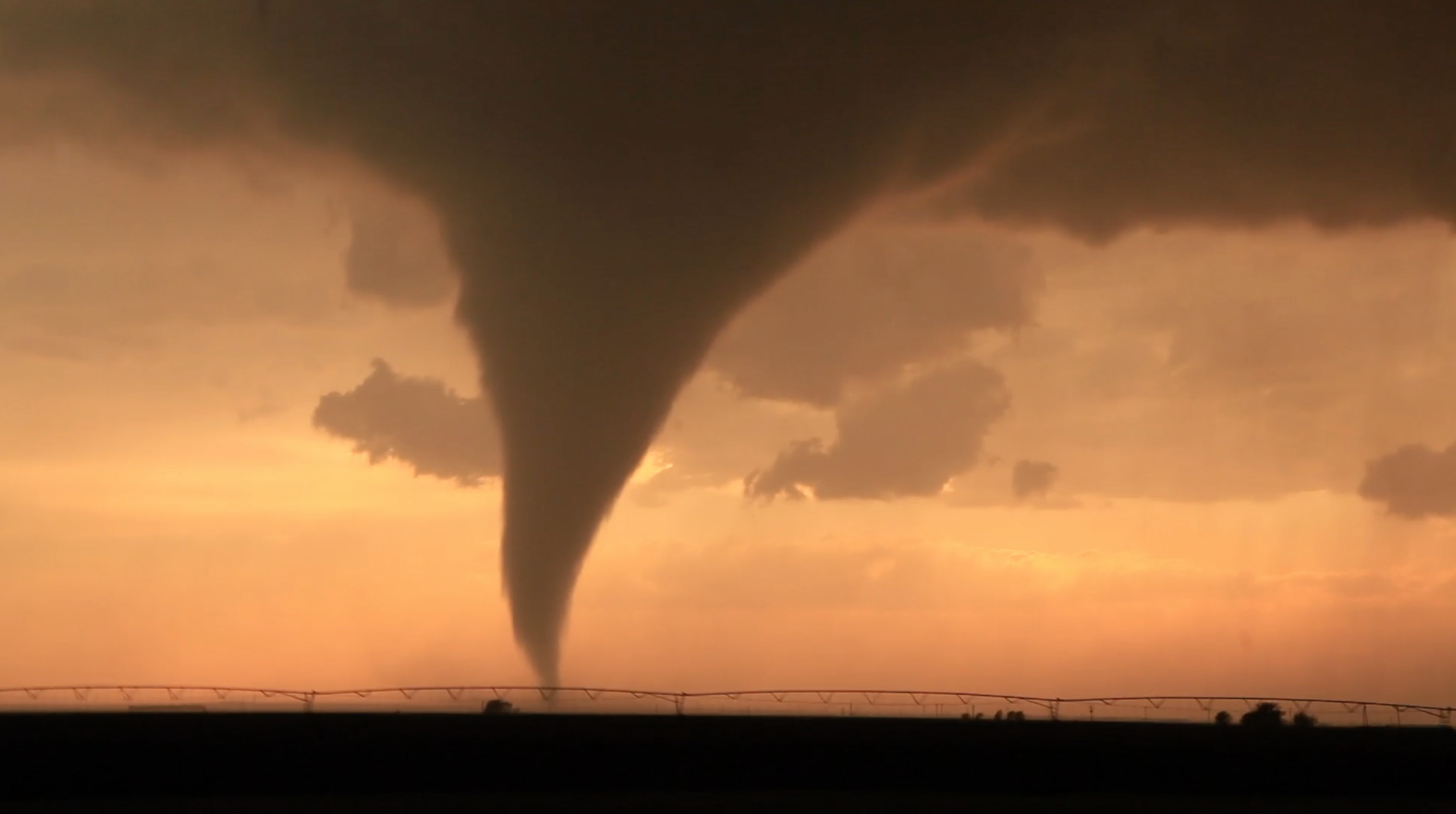 Tornado spout on the horizon